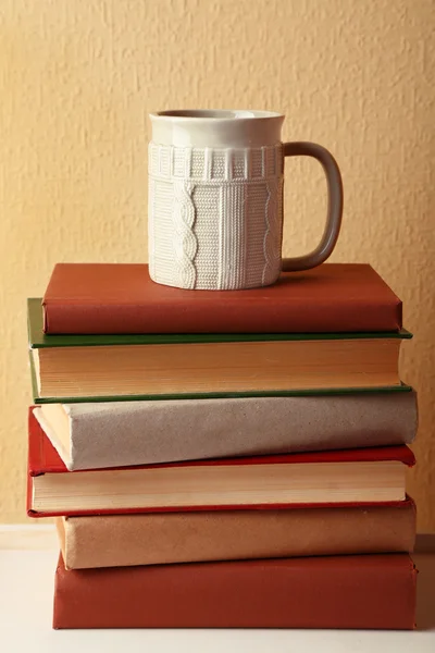 Pile of books with cup — Stock Photo, Image