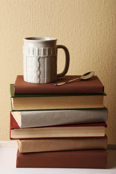 Pile of books with cup — Stock Photo, Image