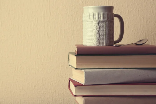 Pile of books with cup — Stock Photo, Image