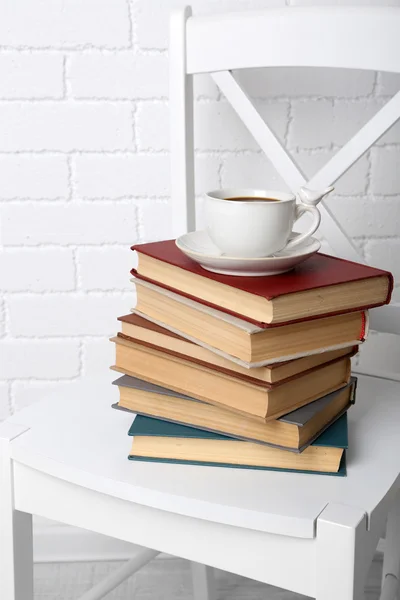 Pile of books with cup — Stock Photo, Image