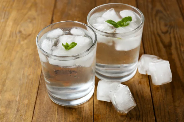 Glasses of water with ice cubes — Stock Photo, Image