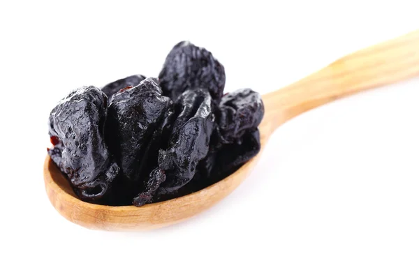 Wooden spoon of prunes — Stock Photo, Image