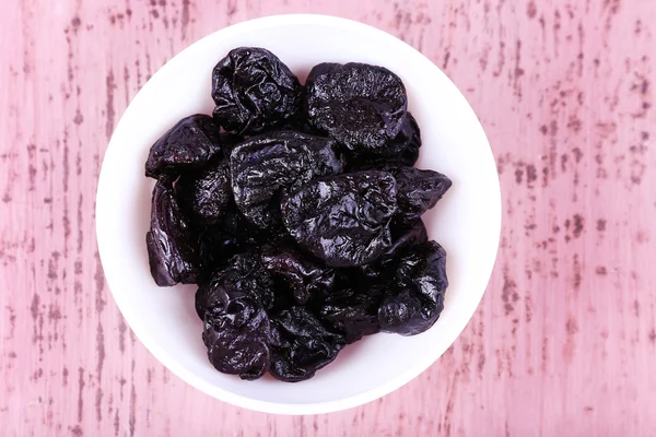 Bowl with heap of prunes — Stock Photo, Image