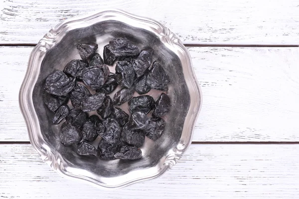 Metal plate of prunes — Stock Photo, Image