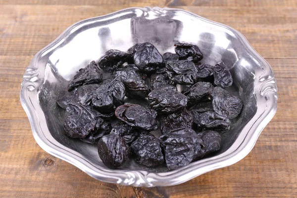 Metal plate of prunes — Stock Photo, Image