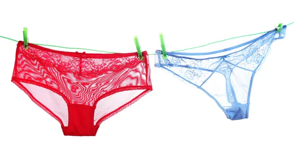 Woman panties hanging on blue background — Stock Photo, Image