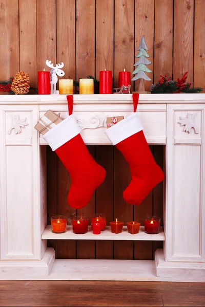 Christmas socks on fireplace — Stock Photo, Image