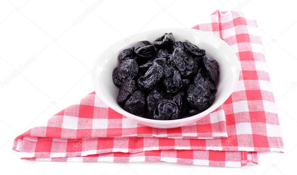White bowl of prunes