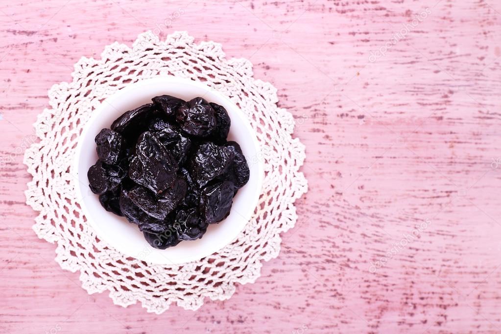 Prunes in bowl on lace