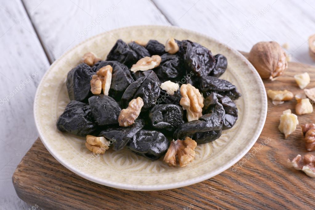 Plate of prunes and walnuts