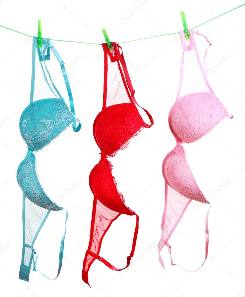 Woman bra hanging on rope isolated on white background Stock Photo by  ©belchonock 61089523