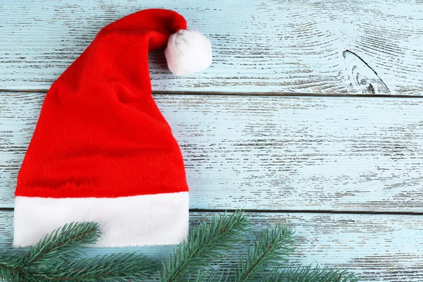 Santa hat with branch of fir-tree — Stock Photo, Image