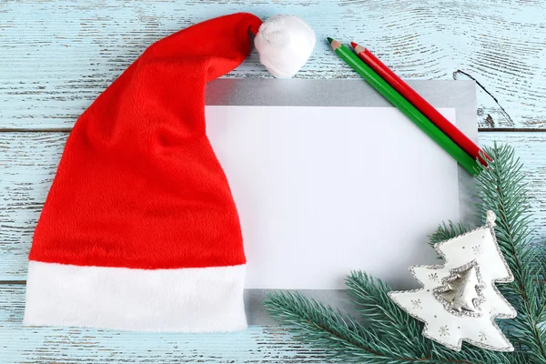 Santa hat with branch of fir-tree — Stock Photo, Image