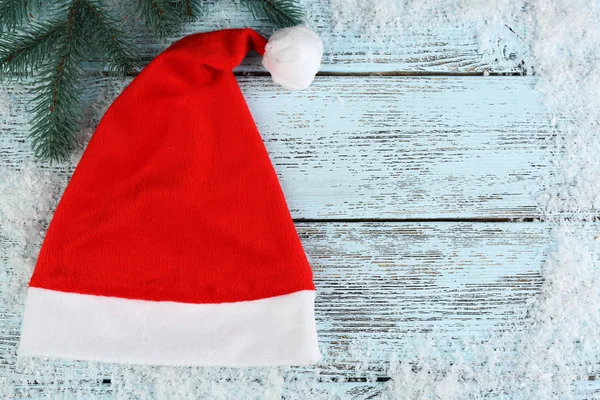 Santa hat with branch of fir-tree — Stock Photo, Image