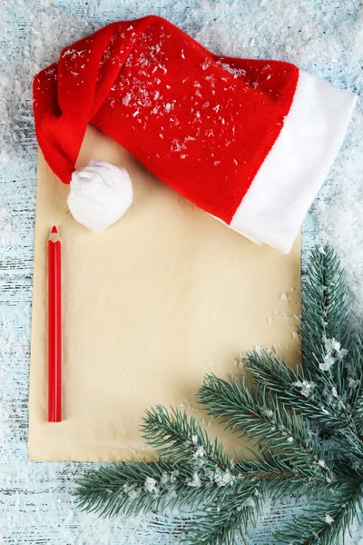 Santa hat with branch of fir-tree — Stock Photo, Image