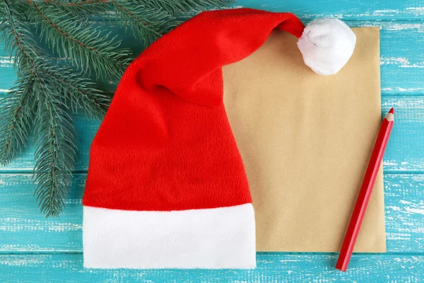 Santa hat with branch of fir-tree — Stock Photo, Image