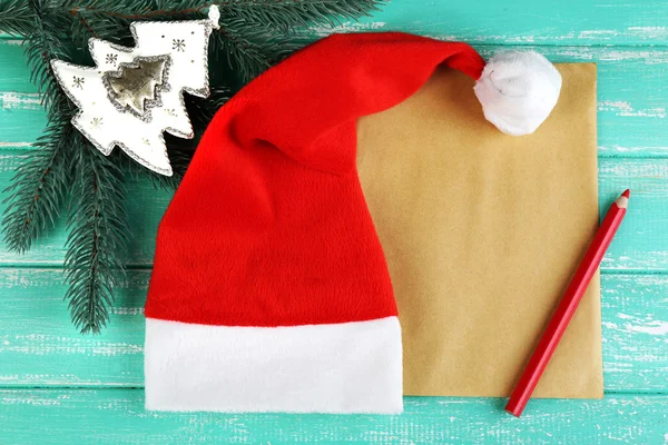 Santa hat with branch of fir-tree — Stock Photo, Image