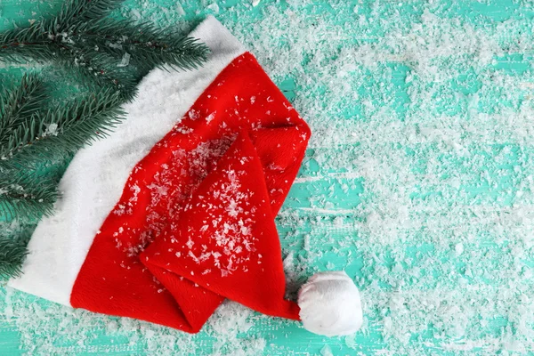 Santa hat with branch of fir-tree — Stock Photo, Image