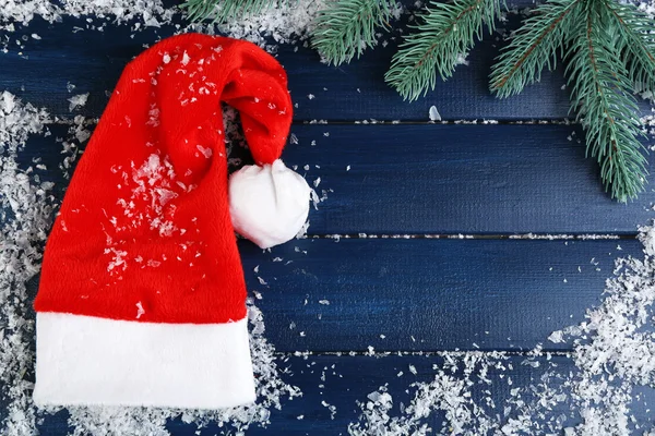 Santa hat with branch of fir-tree — Stock Photo, Image