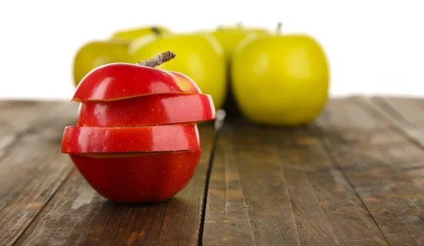 Cut apple on wooden table