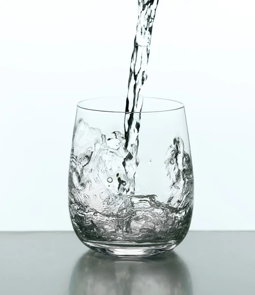 Pouring water from bottle — Stock Photo, Image