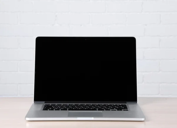 Modern laptop on table — Stock Photo, Image