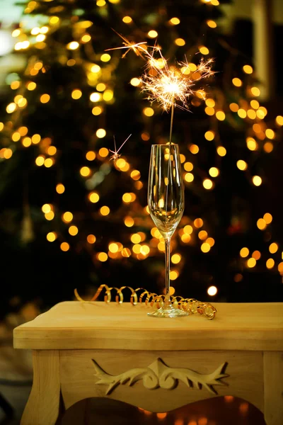 Beautiful sparkler in glass on shiny background, close up — Stock Photo, Image