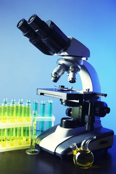 Microscope and test tubes — Stock Photo, Image