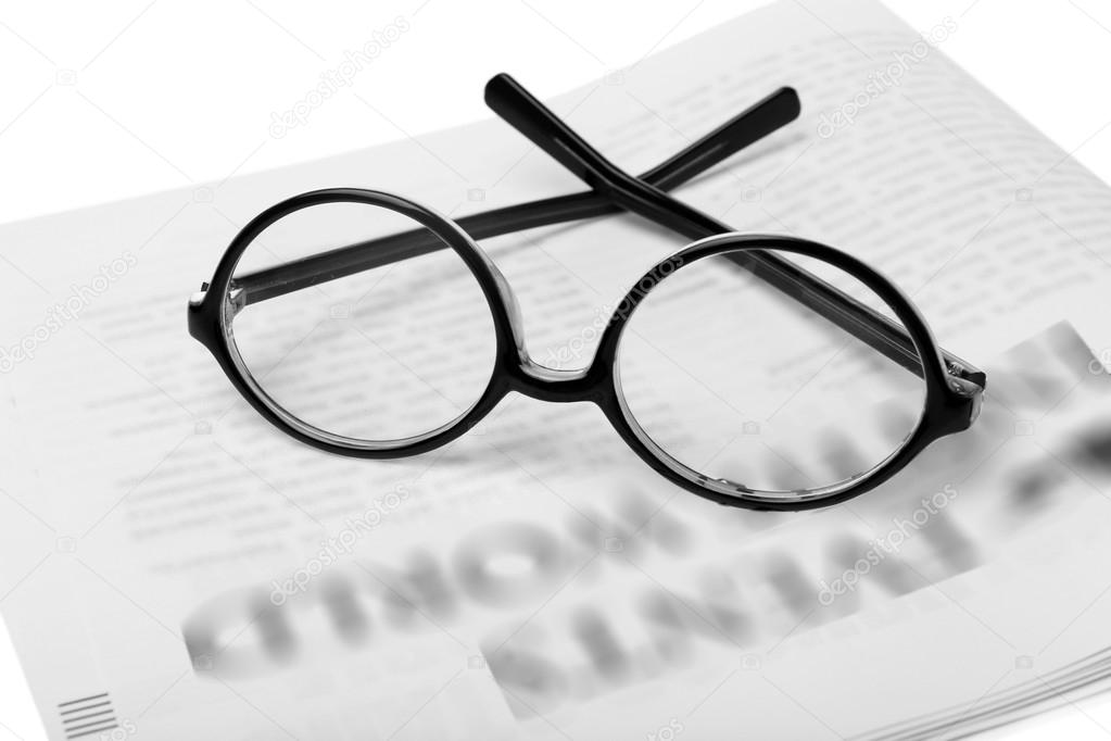 Glasses and newspapers background