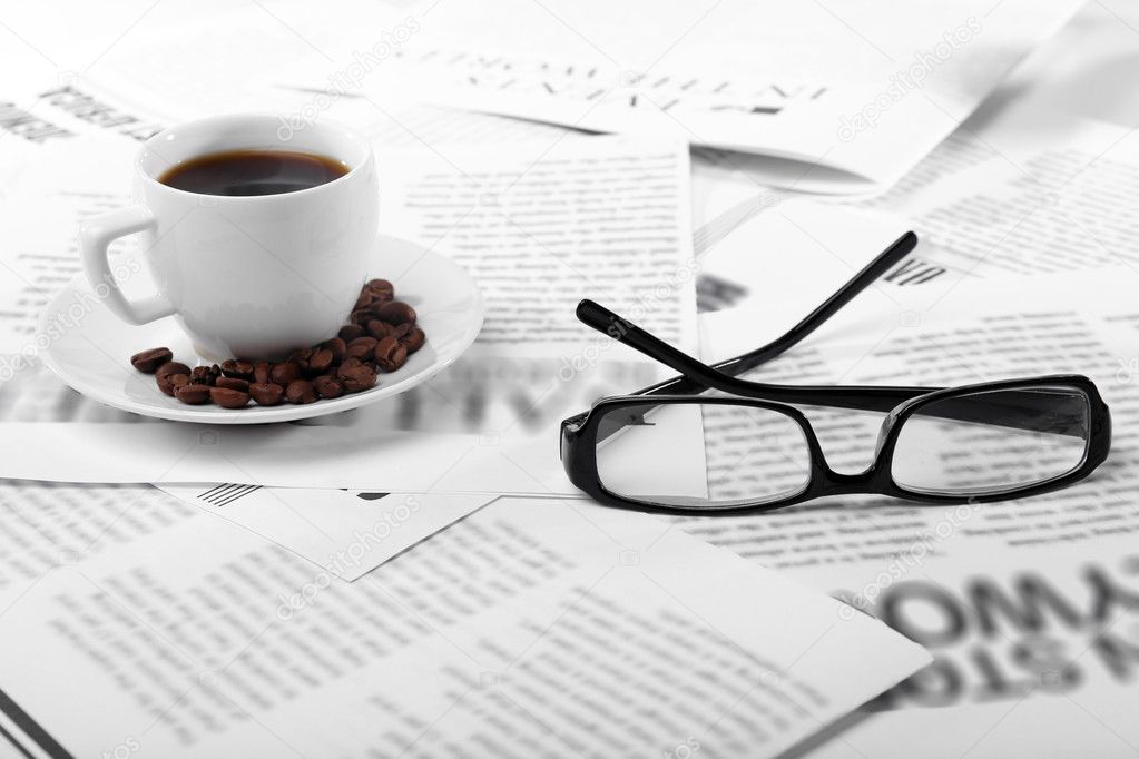 Glasses and newspapers close up