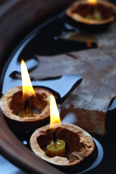 Nutshells with candles — Stock Photo, Image