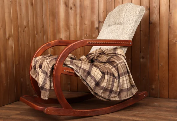Rocking chair covered with plaid — Stock Photo, Image