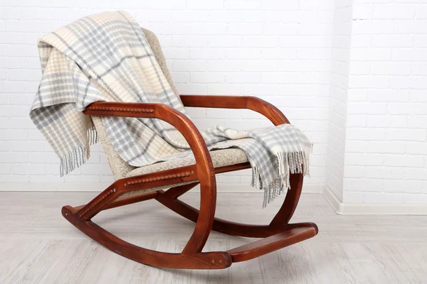 Rocking chair covered with plaid — Stock Photo, Image