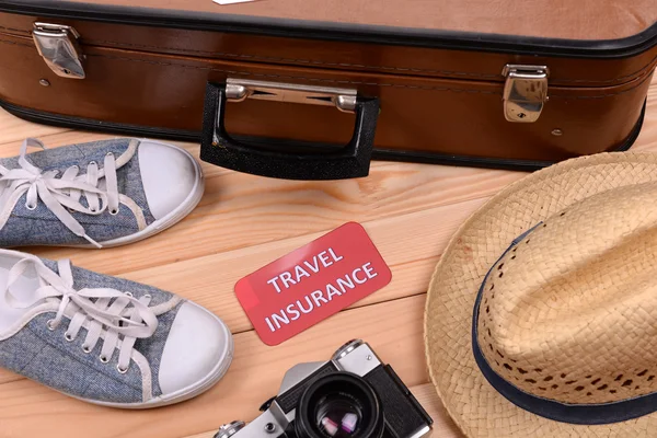 Suitcase and tourist stuff — Stock Photo, Image