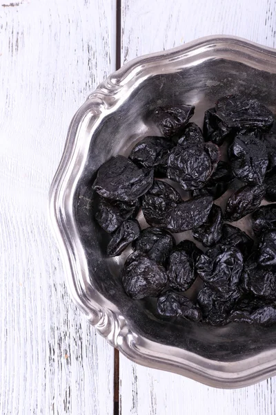 Metal plate of prunes — Stock Photo, Image