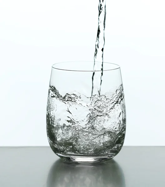Pouring water from bottle — Stock Photo, Image