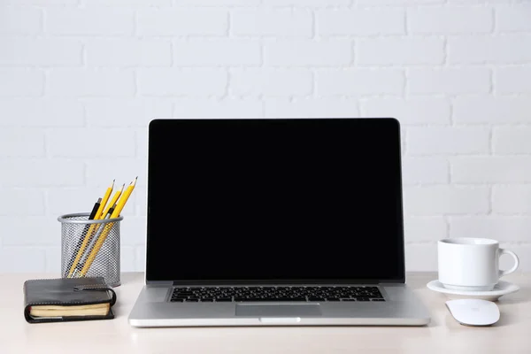 Modern laptop on table — Stock Photo, Image