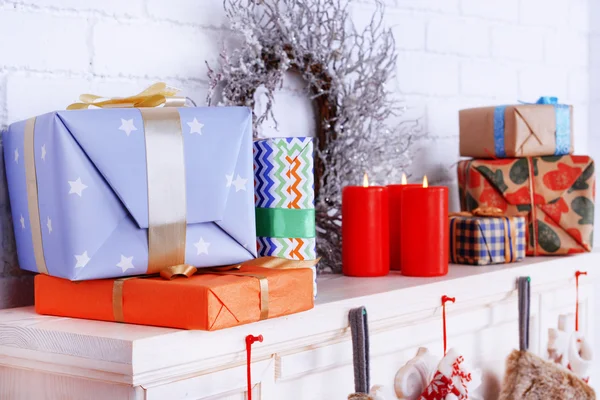 Mantelpiece with Christmas gifts — Stock Photo, Image