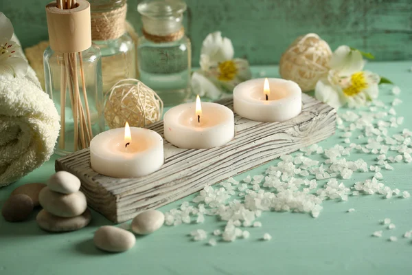 Candles, bottles sea salt — Stock Photo, Image