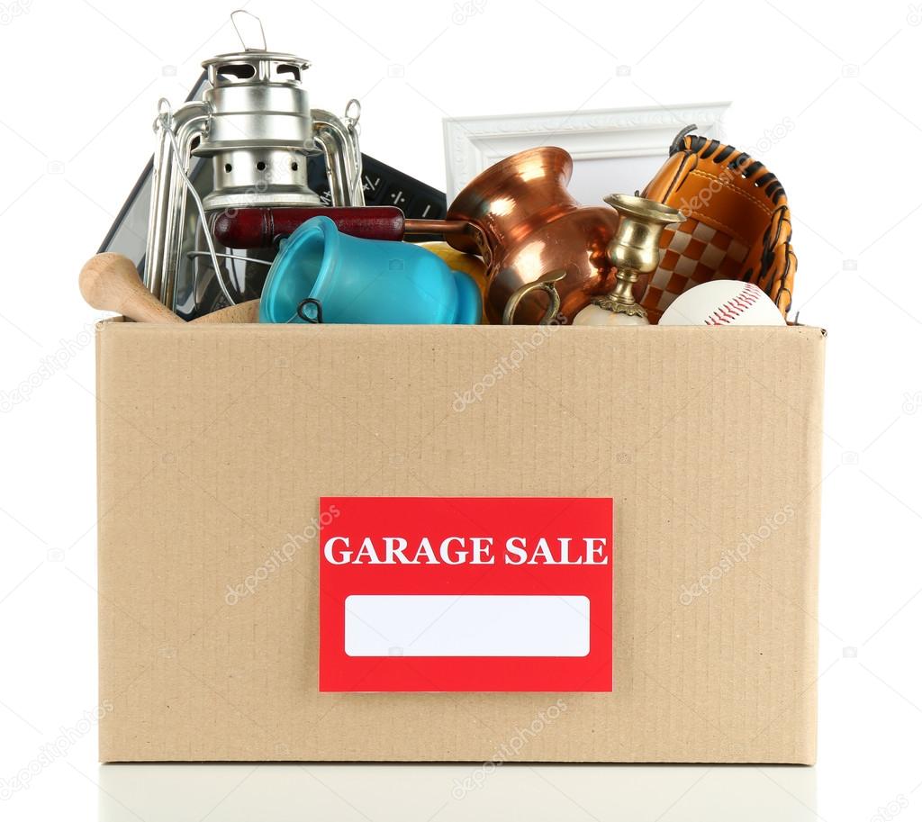 Box of unwanted stuff ready for a garage sale, isolated on white