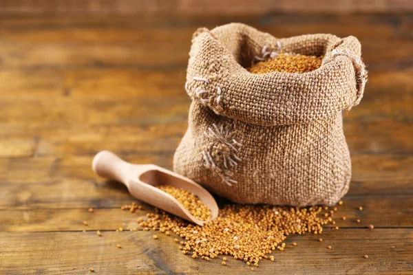 Mustard seeds in bag — Stock Photo, Image