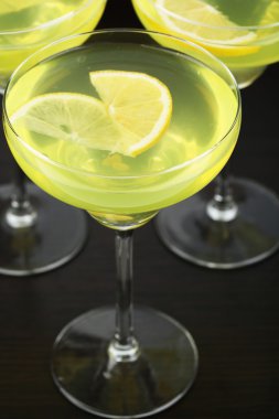 Glasses of fruit cocktails on table close-up