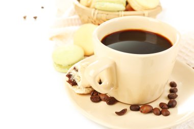 Gentle colorful macaroons in  wicker basket and black coffee in mug isolated on white