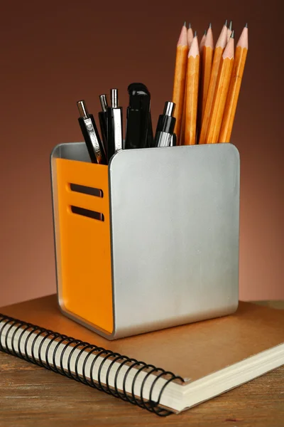Pens and pencils in metal holder — Stock Photo, Image
