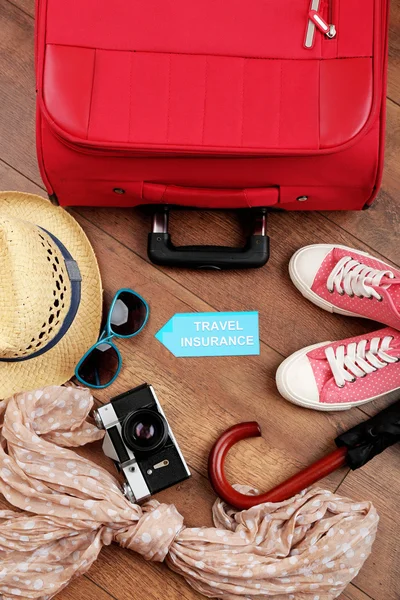 Suitcase and tourist stuff — Stock Photo, Image