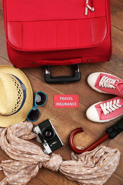 Suitcase and tourist stuff — Stock Photo, Image