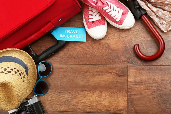 Suitcase and tourist stuff — Stock Photo, Image