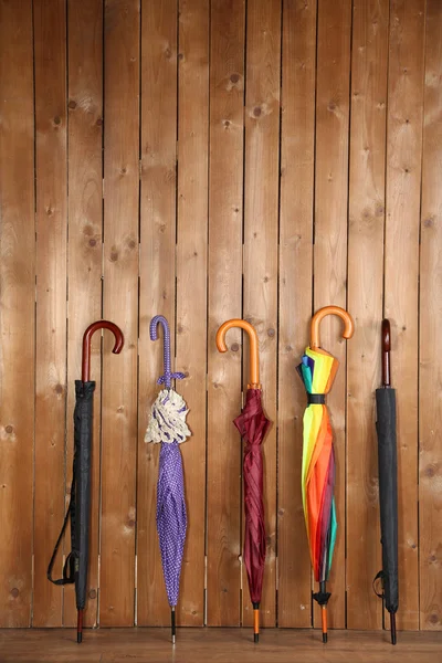 Umbrellas leaning over wall — Stock Photo, Image