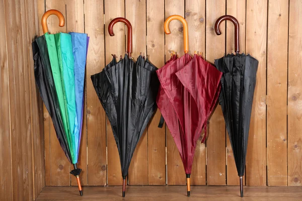 Umbrellas leaning over wall — Stock Photo, Image