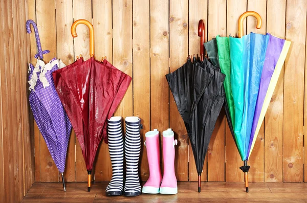 Umbrellas leaning over wall — Stock Photo, Image